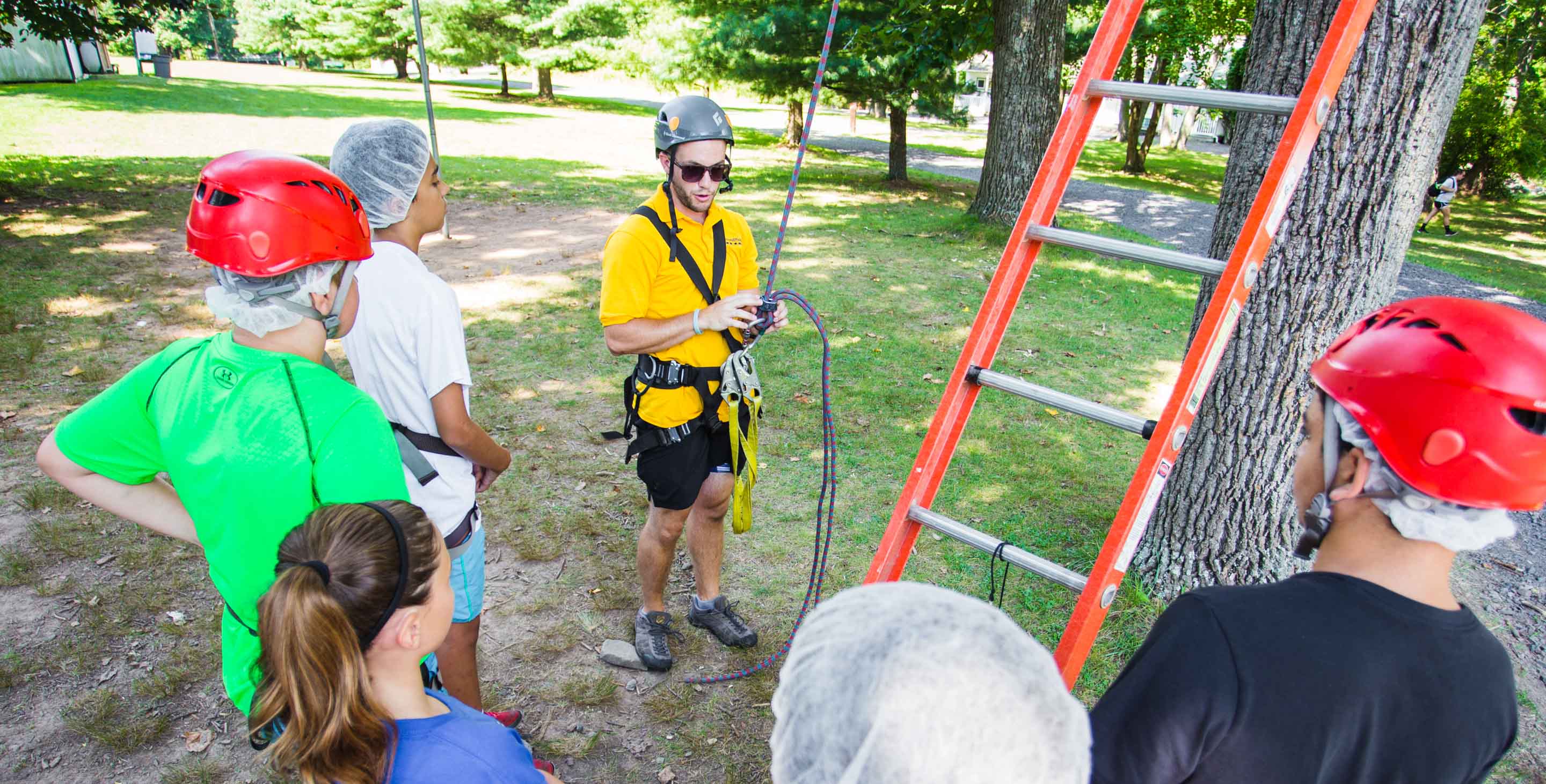 Specialist staff with children by ropes course