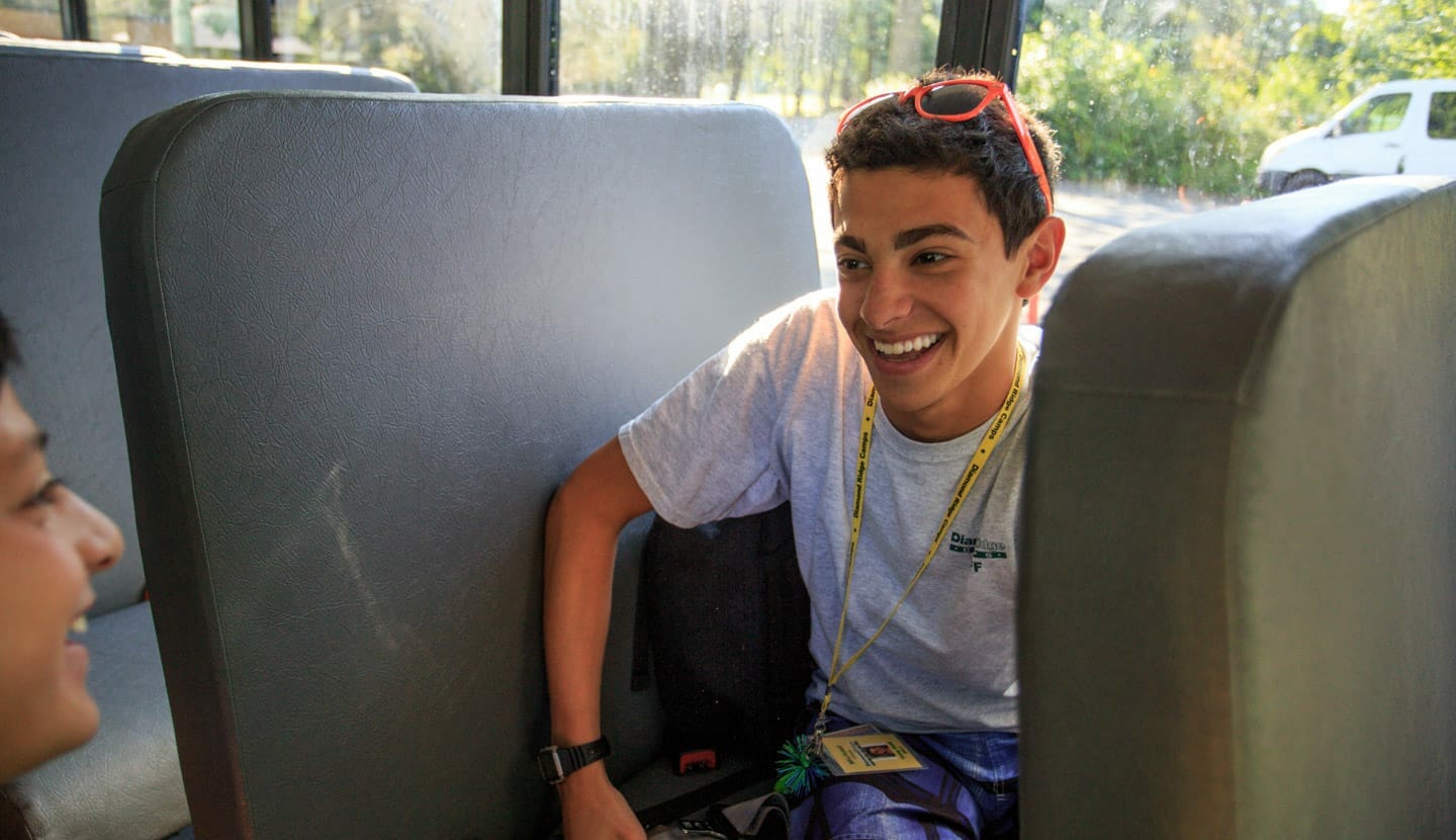 Kids riding the bus to camp